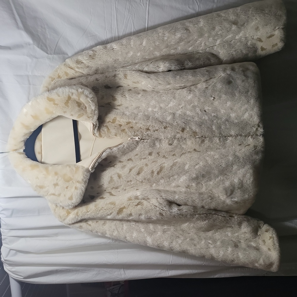 Reversible furry one side, raincoat other side